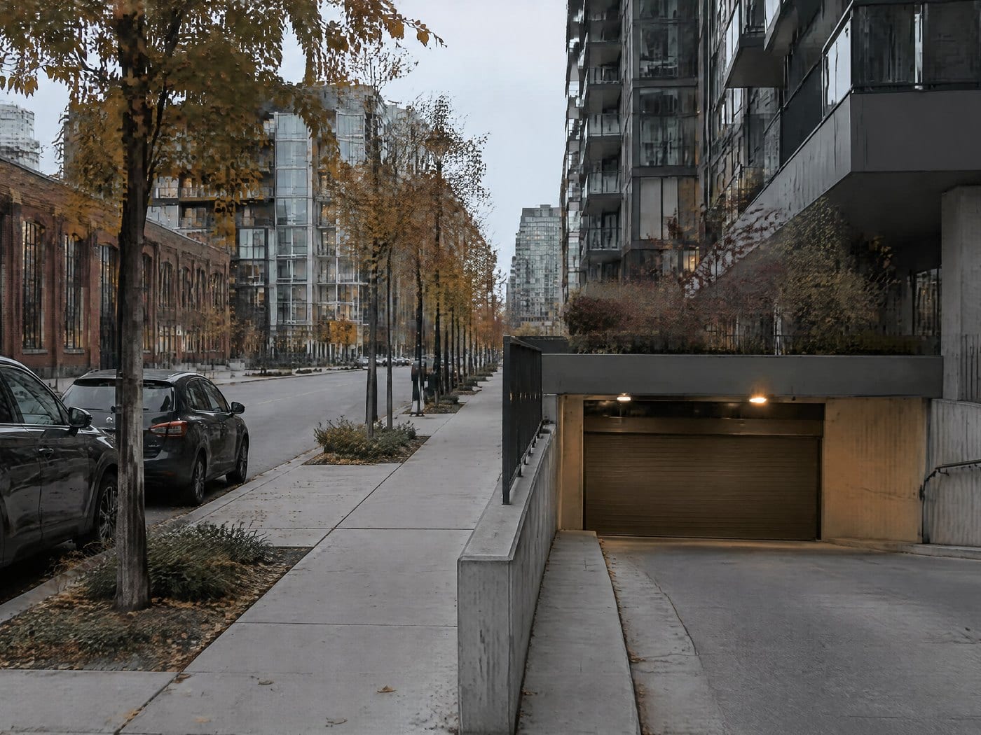 A condo building with an underground garage entrance